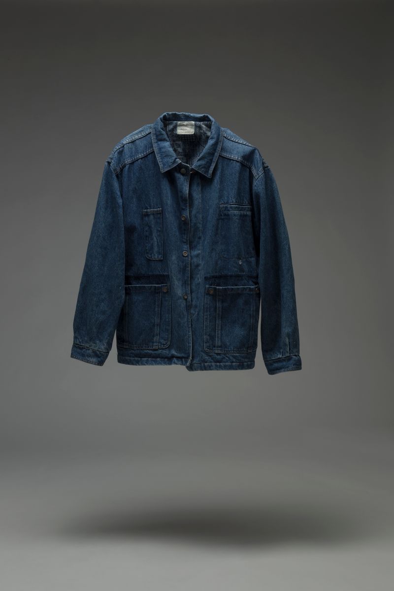 Stylish denim jacket photographed in studio lighting, featuring classic design.