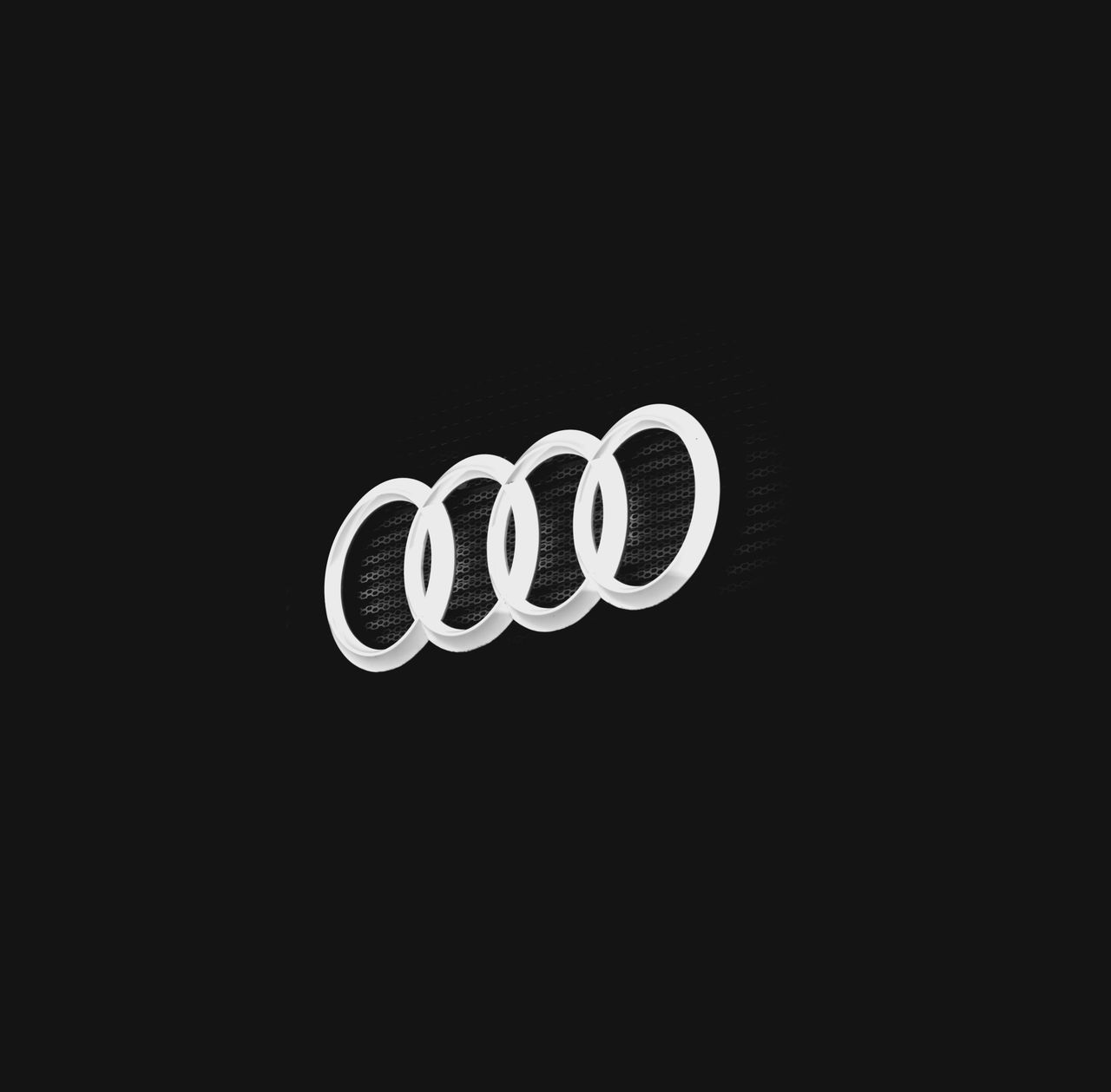 Close-up of a car emblem on a dark background, showcasing minimal design.