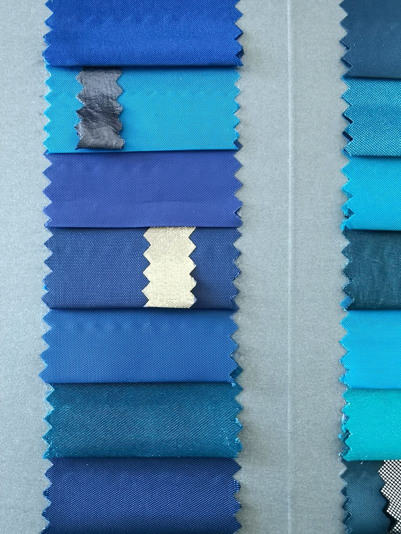 Collection of blue fabric swatches in different shades and textures.